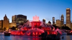 Chicago’s Clarence Buckingham Memorial Fountain glows in bright red colors during one of its nightly summertime light shows