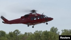 A helicopter takes off following U.S. military aircraft crash in Darwin, Australia, August 27, 2023.