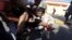 People carry a man who was injured when Libyan militiamen opened fire into a crowd of protesters in Tripoli, Nov. 15, 2013. 