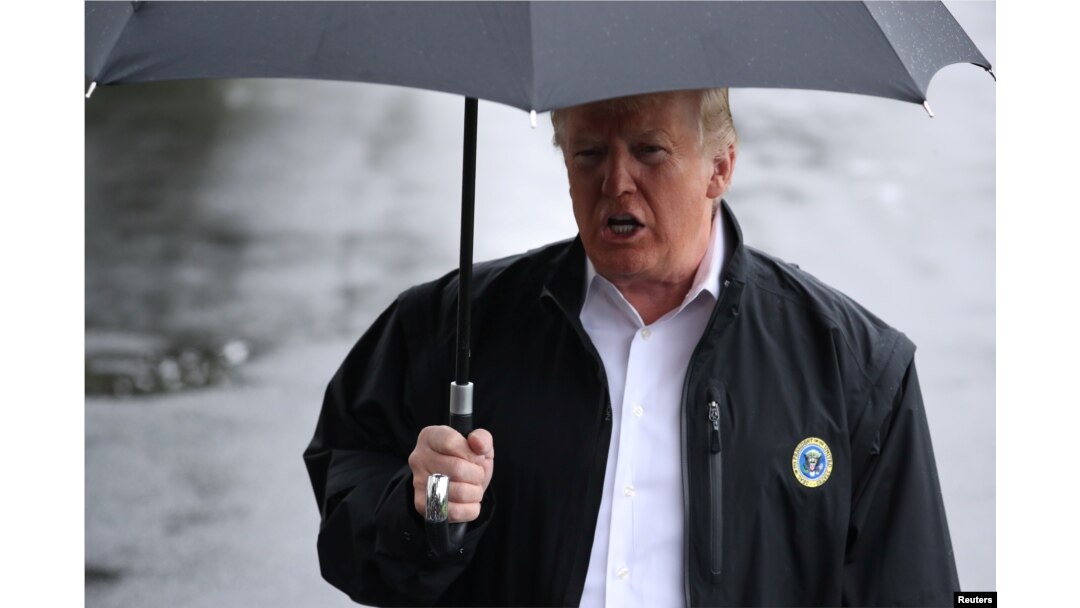 U.S. President Donald Trump talks to reporters from the White House in Washington, October 15, 2018 before leaving for Florida to inspect hurricane damage there.