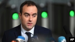 FILE - French Defense Minister Sebastien Lecornu speaks with the media as he arrives for a meeting of NATO defense ministers at NATO headquarters in Brussels, Feb. 13, 2025.