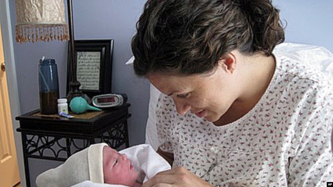 Karen Kramer with daughter, Stella Grace, shortly after giving birth at home.