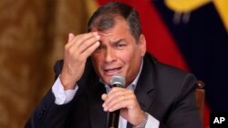 Ecuador's President Rafael Corrrea gestures during a meeting with the foreign press, in Quito, Ecuador, Jan. 20, 2016. 