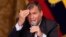 Ecuador's President Rafael Corrrea gestures during a meeting with the foreign press, in Quito, Ecuador, Jan. 20, 2016. 