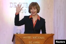 Minnesota Lt. Governor Tina Smith waves to journalists at the end of a news conference in a Hotel in Havana, Cuba, June 22, 2017.