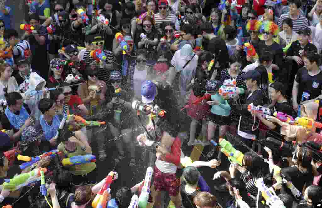 Participants spray water guns at each other during the 3rd Water Gun Festival in Seoul, South Korea.