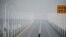 A man who arrived from Hubei province crosses the Jiujiang Yangtze River Bridge near a checkpoint in Jiujiang, Jiangxi province, China, as the country is hit by an outbreak of a new coronavirus, Jan. 31, 2020.