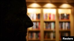 A silhouette of the bust of the co-owner of Royal Carribean International, Arne Wilhelmsen, is seen in the library on board the Freedom of the Seas ship docked in Southampton, southern England April 29, 2006.