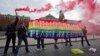 Gay rights activists hold a banner reading 'Homophobia - the religion of bullies' during their action in protest at homophobia, on Red Square in Moscow, Russia, July 14, 2013.