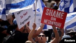 FILE —People gather to protest Israeli Prime Minister Benjamin Netanyahu's visit to California as he is scheduled to meet with entrepreneur Elon Musk, at Union Square in San Francisco, California, U.S. September 18, 2023.