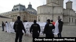 Protesters of the baptism rite as a petition for changes to the ritual was given to the Orthodox Church officials in Bucharest on February 15, 2021.