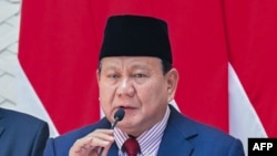 This photograph  provided connected  Nov. 8, 2024, by the Presidential Palace shows Indonesian President Prabowo Subianto speaking to the property   astatine  Halim Perdanakusuma Air Base successful  Jakarta earlier  departing for his sojourn  to Beijing.