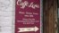 A sign announcing Caffè Lena