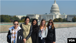 Ruoxi Zhang (left) and PR colleagues on the VOA rooftop