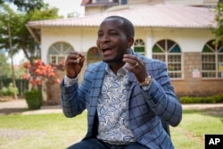 Former Facebook content moderator Nathan Nkunzimana speaks to The Associated Press in Nairobi, Kenya, Friday, June 9, 2023. Nearly 200 former content moderators for Facebook are suing the company and a local contractor in a court case in Kenya that could have implications for the work worldwide. (AP Photo/Khalil Senosi)