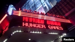 FILE - A marquee advertising "The Hunger Games" is seen at the AMC Loews Lincoln Square Theater in New York, March 22, 2012. 