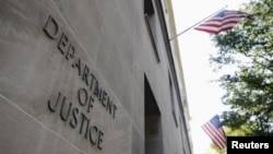 FILE - The exterior of the U.S. Department of Justice headquarters building in Washington is seen in a July 14, 2009, photo.