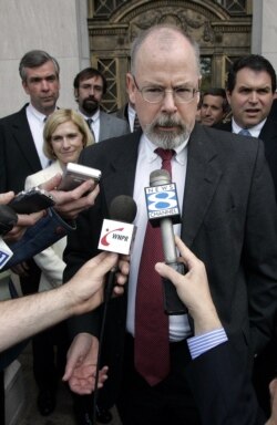 FILE - John Durham speaks to reporters at the U.S. District Court in New Haven, Conn., April 25, 2006.