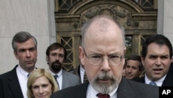 In this April 25, 2006, file photo, John Durham speaks to reporters on the steps of U.S. District Court in New Haven, Conn. 