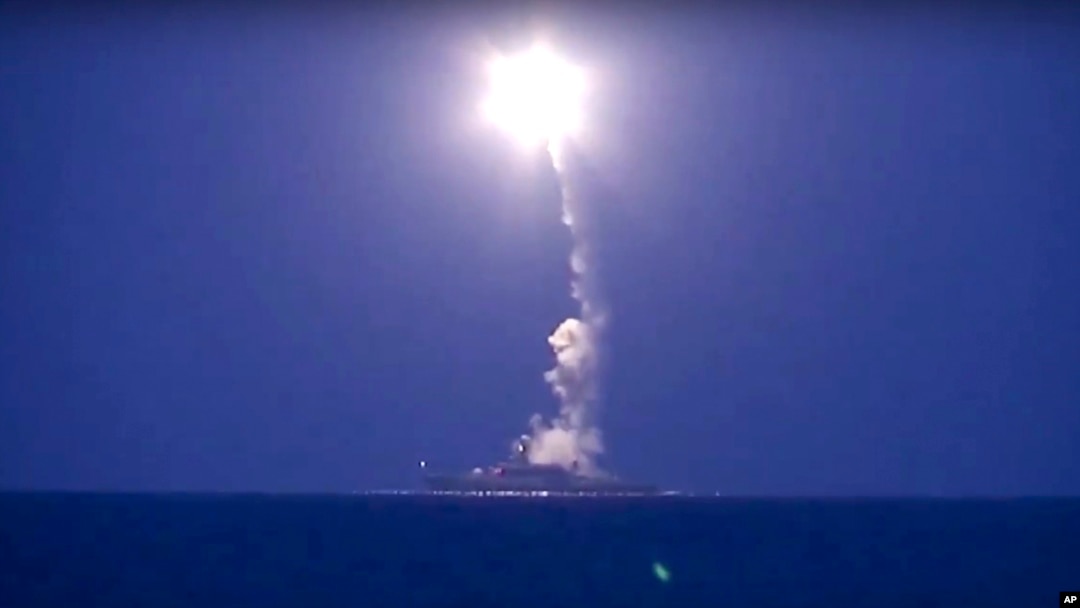 In this photo made from the footage taken from Russian Defense Ministry official website, a Russian navy ship on the Caspian Sea launches a cruise missile toward Islamic State targets in Syria, the ministry said, Oct. 7, 2015.