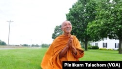 Buddhist monk Sutham Nateetong talks with VOA Thai after finished his daily walk outside Arcola, IN. June 8, 2019.