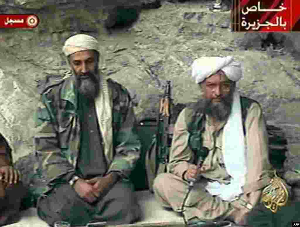 Osama bin Laden, left, with his top lieutenant Egyptian Ayman al-Zawahri, is seen at an undisclosed location in this television image broadcast Sunday, Oct. 7, 2001. Bin Laden praised God for the Sept. 11 terrorist attacks and swore America &quot;will nev