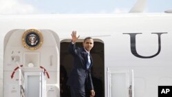 President Barack Obama walks to board Air Force One en route to Miami, at Andrews Air Force Base, Maryland, February 23, 2012.