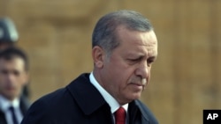 Turkish President Recep Tayyip Erdogan walks to the mausoleum of Turkey's founder Mustafa Kemal Ataturk on Republic Day in Ankara, Turkey, Oct. 29, 2015.