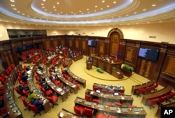 FILE - Opposition lawmaker Nikol Pashinyan speaks during a parliament session to choose a prime minister in Yerevan, May 1, 2018.