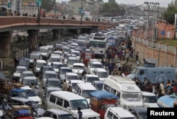 FILE - Vehicles jam a road in Srinagar, India, Oct. 26, 2015.