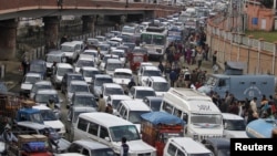 FILE - Vehicles jam a road in Srinagar, India, Oct. 26, 2015. 