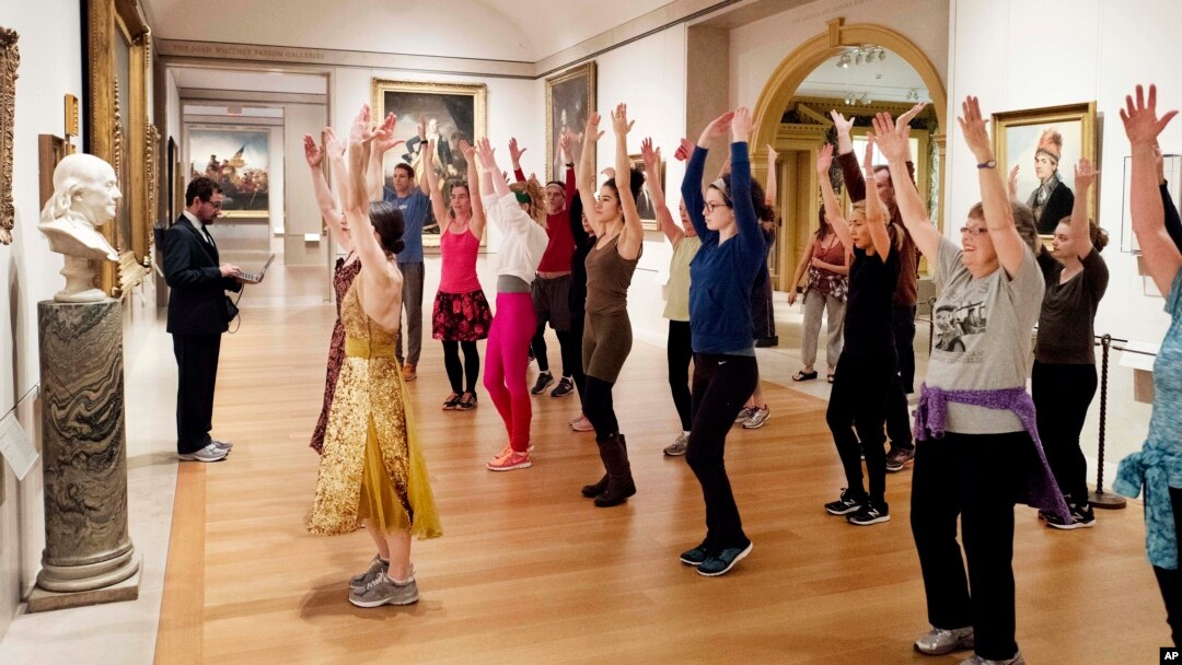FILE - An exercise group works out in front of a bust of Benjamin Franklin at the Metropolitan Museum of Art in New York, Feb. 10, 2017. A new study suggests growing gaps in life expectancy in the U.S.