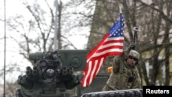 Soldiers of the U.S. Army 3rd squadron, 2nd Cavalry Regiment as the troops of the "Dragoon Ride" military exercise arrive at their home base at Rose Barracks in Vilseck April 1, 2015. The "Dragoon Ride" military exercise involves soldiers of the U.S. Army