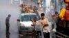 People play with water as they celebrate Myanmar New Year Water Festival in Yangon, April 12, 2016.