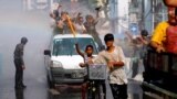 People play with water as they celebrate Myanmar New Year Water Festival in Yangon, April 12, 2016.