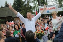 FILE - Polish President Andrzej Duda meets Highlanders during his election rally in Zakopane, Poland, June 23, 2020.