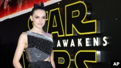 FILE - Daisy Ridley poses for photographers upon arrival at the European premiere of the film "Star Wars: The Force Awakens" in London, Dec. 16, 2015.