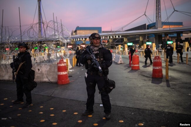 U.S. Customs and Border Protection Special Response Team officers stand guard at the San Ysidro Port of Entry after the land border crossing was temporarily closed to traffic from Tijuana, Mexico, Nov. 19, 2018.