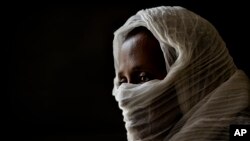 FILE - A 40-year-old woman who says she was held captive and repeatedly raped by 15 Eritrean soldiers over a period of a week in a remote village near the Eritrea border, speaks during an interview at a hospital in Mekele, in the Tigray region of Ethiopa.