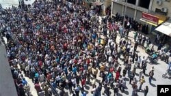 In this citizen journalism image made on a mobile phone, Syrian anti-government protesters gather in the coastal town of Banias, May 6, 2011