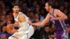 FILE - New York Knicks center Enes Kanter, left, controls the ball against Sacramento Kings center Kosta Koufos at Madison Square Garden in New York, Nov. 11, 2017.