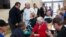 President Barack Obama and New Jersey Gov. Chris Christie talk with local residents at the Brigantine Beach Community Center in Brigantine, New Jersey, October 31, 2012. 