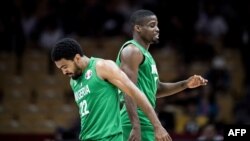 FILE - Basketball players jostle each other during Nigeria's Final Four in Lagos, Nigeria, Sept. 5, 2013. Nigeria's first game in the new Basketball Africa League kicks off May 16, 2021, against Rwanda. 