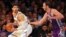 FILE - New York Knicks center Enes Kanter, left, controls the ball against Sacramento Kings center Kosta Koufos at Madison Square Garden in New York, Nov. 11, 2017.