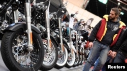 FILE - Harley-Davidson bikes are lined up at a bike fair in Hamburg, Germany, Feb. 24, 2017. 