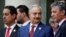 Khalifa Haftar, center, the military commander who dominates eastern Libya, leaves after an international conference on Libya at the Elysee Palace in Paris, May 29, 2018.