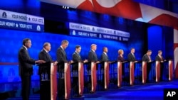 Republican presidential candidates, from left, John Kasich, Mike Huckabee, Jeb Bush, Marco Rubio, Donald Trump, Ben Carson, Carly Fiorina, Ted Cruz, Chris Christie, and Rand Paul take the stage during the CNBC Republican presidential debate at the University of Colorado, Wednesday, Oct. 28, 2015, in Boulder, Colo.