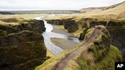 This photo taken Wednesday, May 1, 2019, shows a cliff at the Fjadrárgljúfur canyon in southeastern Iceland.