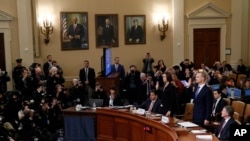 Former White House national security aide Fiona Hill and David Holmes, a U.S. diplomat in Ukraine, are sworn in before testifying before the House Intelligence Committee on Capitol Hill in Washington, Nov. 21, 2019, during a public impeachment hearing.