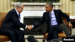 U.S. President Barack Obama and Israeli Prime Minister Benjamin Netanyahu shake hands during their meeting in the Oval Office of the White House in Washington, Nov. 9, 2015.